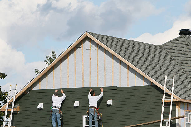 Professional Siding technician working in Churchville, NY
